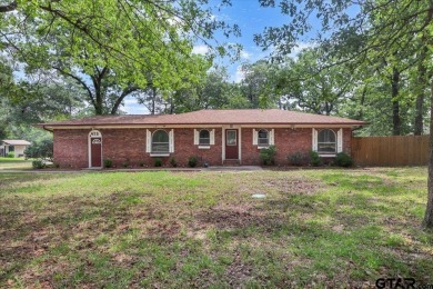 Welcome to your serene retreat in the gated community of on Hide-A-Way Lake Golf Course in Texas - for sale on GolfHomes.com, golf home, golf lot