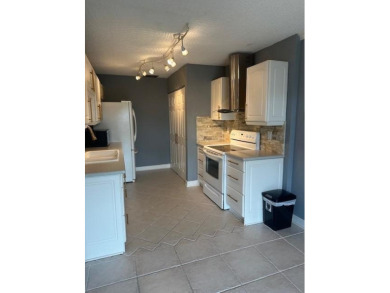 Move in ready 2 bedroom, 2 bathroom, updated villa with 2 on Cypress Lakes Golf Course - West Palm Beach in Florida - for sale on GolfHomes.com, golf home, golf lot
