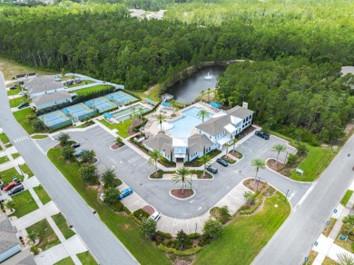 Tranquil Living On The Pond In This Exclusive Gated Golf on Grand Reserve Golf Course in Florida - for sale on GolfHomes.com, golf home, golf lot