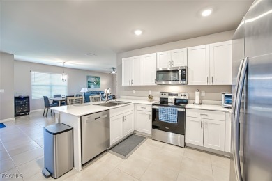 This 2023-built 2-bedroom + den, 2-bathroom attached villa is on Herons Glen Golf and Country Club in Florida - for sale on GolfHomes.com, golf home, golf lot