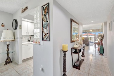 ENJOY STUNNING LAKE VIEWS from your balcony! This LARGEST CORNER on Flamingo Lakes Country Club in Florida - for sale on GolfHomes.com, golf home, golf lot