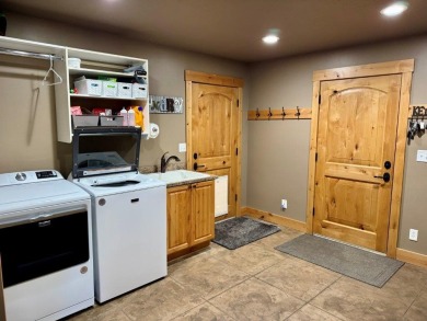 Exceptional custom-built home on over 6 acres, bordered by tens on Double Arrow Lodge in Montana - for sale on GolfHomes.com, golf home, golf lot