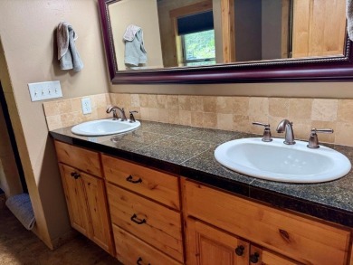 Exceptional custom-built home on over 6 acres, bordered by tens on Double Arrow Lodge in Montana - for sale on GolfHomes.com, golf home, golf lot