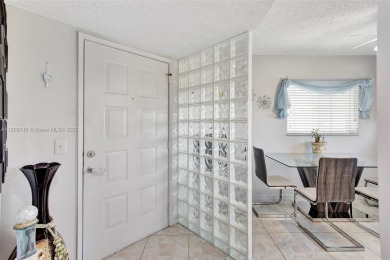 ENJOY STUNNING LAKE VIEWS from your balcony! This LARGEST CORNER on Flamingo Lakes Country Club in Florida - for sale on GolfHomes.com, golf home, golf lot