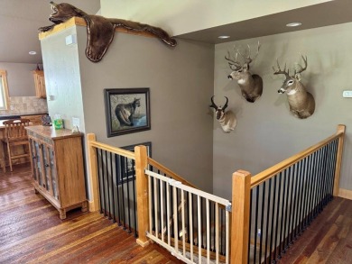 Exceptional custom-built home on over 6 acres, bordered by tens on Double Arrow Lodge in Montana - for sale on GolfHomes.com, golf home, golf lot