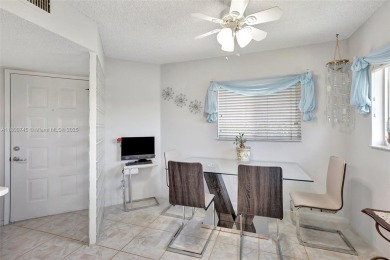 ENJOY STUNNING LAKE VIEWS from your balcony! This LARGEST CORNER on Flamingo Lakes Country Club in Florida - for sale on GolfHomes.com, golf home, golf lot