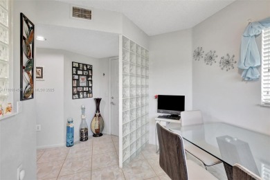 ENJOY STUNNING LAKE VIEWS from your balcony! This LARGEST CORNER on Flamingo Lakes Country Club in Florida - for sale on GolfHomes.com, golf home, golf lot