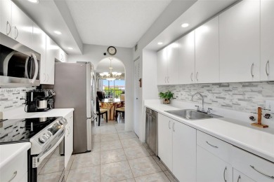 ENJOY STUNNING LAKE VIEWS from your balcony! This LARGEST CORNER on Flamingo Lakes Country Club in Florida - for sale on GolfHomes.com, golf home, golf lot