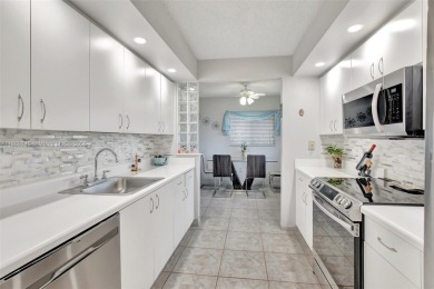 ENJOY STUNNING LAKE VIEWS from your balcony! This LARGEST CORNER on Flamingo Lakes Country Club in Florida - for sale on GolfHomes.com, golf home, golf lot