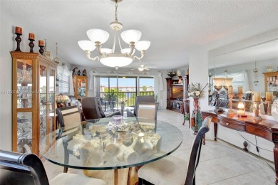 ENJOY STUNNING LAKE VIEWS from your balcony! This LARGEST CORNER on Flamingo Lakes Country Club in Florida - for sale on GolfHomes.com, golf home, golf lot