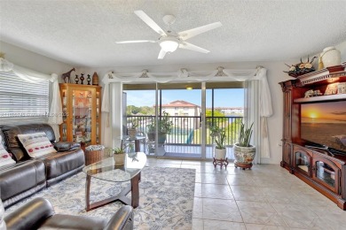 ENJOY STUNNING LAKE VIEWS from your balcony! This LARGEST CORNER on Flamingo Lakes Country Club in Florida - for sale on GolfHomes.com, golf home, golf lot
