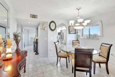 ENJOY STUNNING LAKE VIEWS from your balcony! This LARGEST CORNER on Flamingo Lakes Country Club in Florida - for sale on GolfHomes.com, golf home, golf lot
