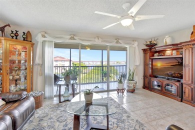 ENJOY STUNNING LAKE VIEWS from your balcony! This LARGEST CORNER on Flamingo Lakes Country Club in Florida - for sale on GolfHomes.com, golf home, golf lot