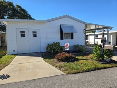 Hidden Golf and Tennis, lot 794, is the home you have been on Lake Henry Golf Club in Florida - for sale on GolfHomes.com, golf home, golf lot