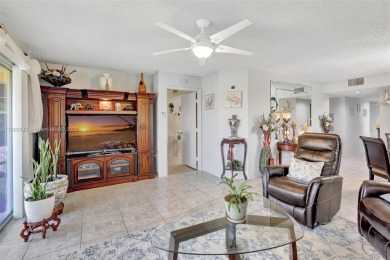 ENJOY STUNNING LAKE VIEWS from your balcony! This LARGEST CORNER on Flamingo Lakes Country Club in Florida - for sale on GolfHomes.com, golf home, golf lot