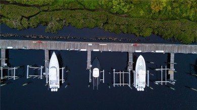 Immaculate two-story Concrete Block home in the prestigious on Palm Cove Golf and Yacht Club in Florida - for sale on GolfHomes.com, golf home, golf lot