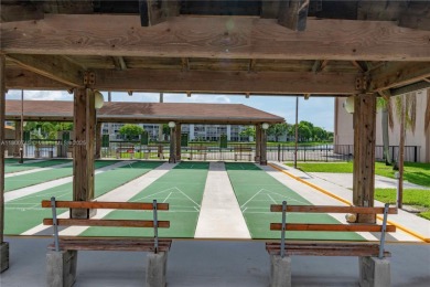 Enjoy stunning LAKE VIEWS from your 4TH FLOOR balcony! This on Flamingo Lakes Country Club in Florida - for sale on GolfHomes.com, golf home, golf lot