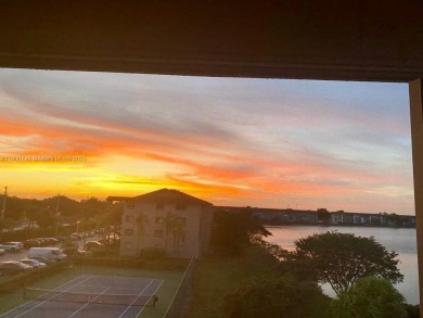 Enjoy stunning LAKE VIEWS from your 4TH FLOOR balcony! This on Flamingo Lakes Country Club in Florida - for sale on GolfHomes.com, golf home, golf lot