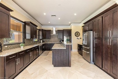 This beautifully maintained 4-bed plus den, 4-bath residence in on Valencia Golf and Country Club in Florida - for sale on GolfHomes.com, golf home, golf lot