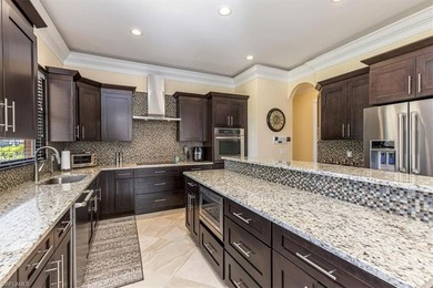 This beautifully maintained 4-bed plus den, 4-bath residence in on Valencia Golf and Country Club in Florida - for sale on GolfHomes.com, golf home, golf lot