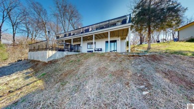 Panoramic waterfront views from this totally remodeled lake home on Boots Randolph Golf Course in Kentucky - for sale on GolfHomes.com, golf home, golf lot