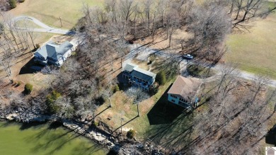 Panoramic waterfront views from this totally remodeled lake home on Boots Randolph Golf Course in Kentucky - for sale on GolfHomes.com, golf home, golf lot