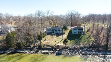 Panoramic waterfront views from this totally remodeled lake home on Boots Randolph Golf Course in Kentucky - for sale on GolfHomes.com, golf home, golf lot