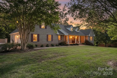 Spacious mostly brick home with main level living located in the on Granada Farms Country Club in North Carolina - for sale on GolfHomes.com, golf home, golf lot