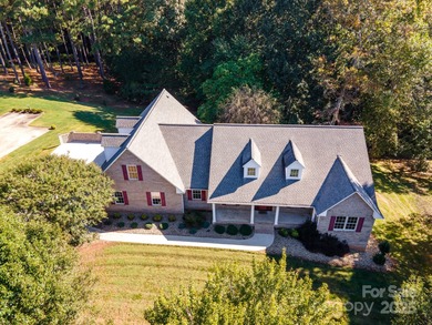 Spacious mostly brick home with main level living located in the on Granada Farms Country Club in North Carolina - for sale on GolfHomes.com, golf home, golf lot