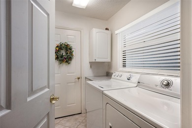 This beautifully maintained Mediterranean Carriage home on Palm Aire Country Club of Sarasota in Florida - for sale on GolfHomes.com, golf home, golf lot