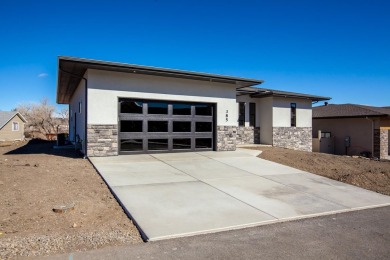 A stunning new home in Redlands Pinnacle Ridge Subdivision on The Golf Club At Redlands Mesa in Colorado - for sale on GolfHomes.com, golf home, golf lot