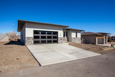 A stunning new home in Redlands Pinnacle Ridge Subdivision on The Golf Club At Redlands Mesa in Colorado - for sale on GolfHomes.com, golf home, golf lot