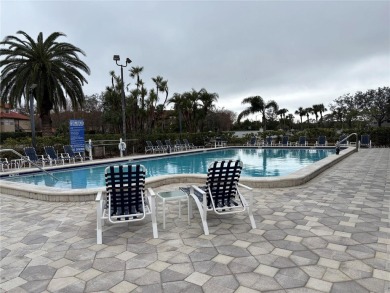 This spacious third-floor end unit offers true resort-type on Feather Sound Country Club in Florida - for sale on GolfHomes.com, golf home, golf lot