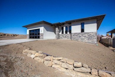 A stunning new home in Redlands Pinnacle Ridge Subdivision on The Golf Club At Redlands Mesa in Colorado - for sale on GolfHomes.com, golf home, golf lot