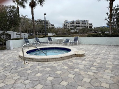 This spacious third-floor end unit offers true resort-type on Feather Sound Country Club in Florida - for sale on GolfHomes.com, golf home, golf lot