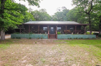 Nestled in the heart of the highly sought-after Holly Lake Ranch on Holly Lake Ranch Golf Club in Texas - for sale on GolfHomes.com, golf home, golf lot