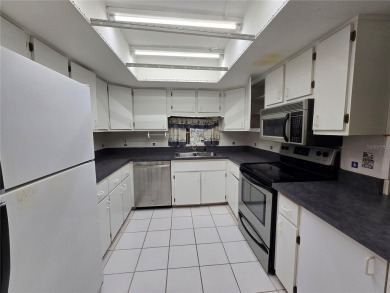 2nd floor condo located in the 55+ community of Live Oak Village on Country Club At Silver Springs Shores in Florida - for sale on GolfHomes.com, golf home, golf lot