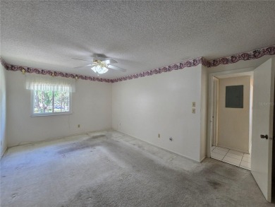 2nd floor condo located in the 55+ community of Live Oak Village on Country Club At Silver Springs Shores in Florida - for sale on GolfHomes.com, golf home, golf lot