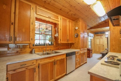 Nestled in the heart of the highly sought-after Holly Lake Ranch on Holly Lake Ranch Golf Club in Texas - for sale on GolfHomes.com, golf home, golf lot