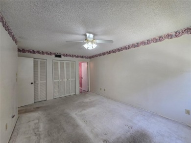 2nd floor condo located in the 55+ community of Live Oak Village on Country Club At Silver Springs Shores in Florida - for sale on GolfHomes.com, golf home, golf lot