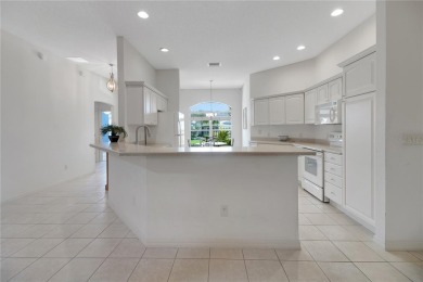 Welcome to this beautifully expanded Gardenia model in Sunset on The Links of Spruce Creek in Florida - for sale on GolfHomes.com, golf home, golf lot