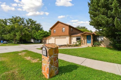 This lovely home in Forest Hills comes with its own fish, flower on Babe Zaharias Golf Course in Florida - for sale on GolfHomes.com, golf home, golf lot