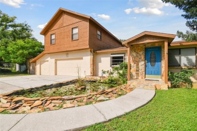 This lovely home in Forest Hills comes with its own fish, flower on Babe Zaharias Golf Course in Florida - for sale on GolfHomes.com, golf home, golf lot