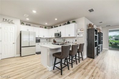 Impeccable, upgrade-rich, and truly move-in ready-this lakefront on Herons Glen Golf and Country Club in Florida - for sale on GolfHomes.com, golf home, golf lot
