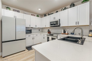 Impeccable, upgrade-rich, and truly move-in ready-this lakefront on Herons Glen Golf and Country Club in Florida - for sale on GolfHomes.com, golf home, golf lot