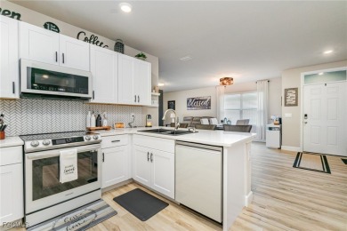 Impeccable, upgrade-rich, and truly move-in ready-this lakefront on Herons Glen Golf and Country Club in Florida - for sale on GolfHomes.com, golf home, golf lot