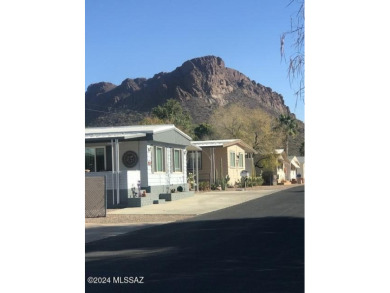 Very nice mostly furnished north facing home with newer windows on Tucson Estates Golf Course in Arizona - for sale on GolfHomes.com, golf home, golf lot