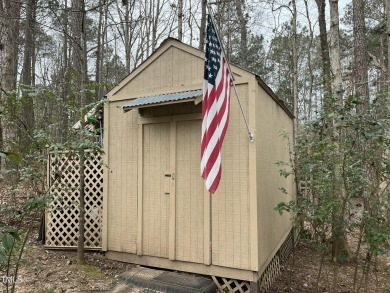 This beautiful 2-bedroom, 2-bathroom home is located in the on River Golf and County Club at Lake Royale in North Carolina - for sale on GolfHomes.com, golf home, golf lot