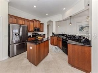 Breathtaking Lake & Sunset Views | Maintenance-Free Luxury on Venetian Golf and River Club in Florida - for sale on GolfHomes.com, golf home, golf lot