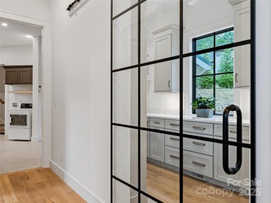 Modern farmhouse elegance meets refined mountain living in this on Country Club of Asheville in North Carolina - for sale on GolfHomes.com, golf home, golf lot
